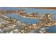 Scenic aerial view showcasing a waterfront community with stunning canals and luxurious homes, perfect for boating enthusiasts at 111 22Nd St, Belleair Beach, FL 33786