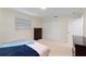 Bedroom with carpet, window, double door closet and dresser at 111 22Nd St, Belleair Beach, FL 33786