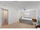 Bedroom with carpet, ceiling fan, and two windows with shutters at 111 22Nd St, Belleair Beach, FL 33786