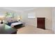 Bedroom featuring two windows, carpet, a desk, and a dresser at 111 22Nd St, Belleair Beach, FL 33786