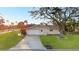 Single-story home featuring a tile roof and attached two car garage at 111 22Nd St, Belleair Beach, FL 33786