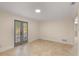 Bright living room with tile flooring, recessed lights, and french doors at 111 22Nd St, Belleair Beach, FL 33786