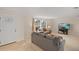 Bright living room featuring neutral walls, plush carpeting, and stylish furnishings with comfortable seating at 111 22Nd St, Belleair Beach, FL 33786