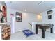 Bonus room featuring a foosball table and decorated with sports memorabilia at 11605 Cleyera Ct, Riverview, FL 33579