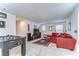 Spacious game room with a large couch and a foosball table for entertaining at 11605 Cleyera Ct, Riverview, FL 33579