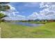 Beautiful water view showcasing the pond and nearby homes in the community at 11605 Cleyera Ct, Riverview, FL 33579