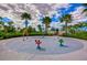 A colorful splash pad with a variety of water features, surrounded by green landscaping and palm trees at 11605 Cleyera Ct, Riverview, FL 33579