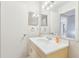 Bright bathroom features a single sink vanity and a large mirror reflecting the shower at 11706 Raintree Village Blvd # D, Temple Terrace, FL 33617