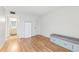 Bedroom featuring wood floors and a custom storage bench with drawers at 11706 Raintree Village Blvd # D, Temple Terrace, FL 33617