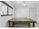 Cozy dining area showcasing a wooden table set beneath a modern geometric light fixture at 11706 Raintree Village Blvd # D, Temple Terrace, FL 33617