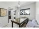 A dining area with tile floors, and a built-in bench next to the open kitchen at 11706 Raintree Village Blvd # D, Temple Terrace, FL 33617