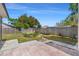 Large backyard with a wooden fence and a small patio area at 1214 Windsor Cir, Brandon, FL 33510
