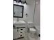 Modern bathroom features white subway tile, white vanity, and black hardware at 1214 Windsor Cir, Brandon, FL 33510
