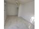 Bright bedroom featuring tile floors and a ceiling fan with light fixture at 1214 Windsor Cir, Brandon, FL 33510