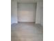 Bedroom featuring open closet space and tile floors at 1214 Windsor Cir, Brandon, FL 33510