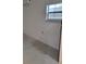 Bedroom featuring light-colored tile floors and air conditioning unit at 1214 Windsor Cir, Brandon, FL 33510