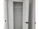 Empty closet showing door and metal rack at 1214 Windsor Cir, Brandon, FL 33510
