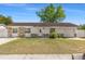 Charming single-story home featuring stone accents, a well-manicured lawn, and an attached garage at 1214 Windsor Cir, Brandon, FL 33510