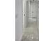 Hallway featuring modern marble flooring with multiple doorways leading to other rooms at 1214 Windsor Cir, Brandon, FL 33510