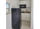 Kitchen featuring stainless steel refrigerator and sleek black microwave at 1214 Windsor Cir, Brandon, FL 33510