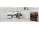 Spacious kitchen with white cabinets, stainless steel appliances, marble floors, and access to the patio at 1214 Windsor Cir, Brandon, FL 33510