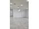 Spacious living room featuring sleek marble floors, white walls, and ample closet space at 1214 Windsor Cir, Brandon, FL 33510