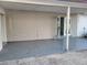 Covered patio with stained concrete flooring and direct access to the interior at 1214 Windsor Cir, Brandon, FL 33510