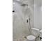 Bathroom shower stall featuring natural stone pebble base and modern fixtures at 1214 Windsor Cir, Brandon, FL 33510