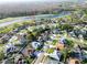 A panoramic view highlights a home near a golf course, enhanced by a lovely pond at 1505 Ventana Dr, Sun City Center, FL 33573