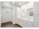 Bright bathroom featuring a double sink vanity with modern white cabinets and a glass-enclosed shower at 1515 14Th S St, St Petersburg, FL 33705