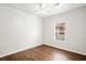 Bedroom featuring a window overlooking the neighborhood and a ceiling fan at 1515 14Th S St, St Petersburg, FL 33705