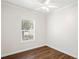 Bedroom featuring a window with wood blinds and a ceiling fan with lighting at 1515 14Th S St, St Petersburg, FL 33705
