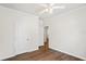 A well-lit bedroom featuring a ceiling fan and two open doorways at 1515 14Th S St, St Petersburg, FL 33705