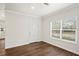 A bright and airy room with a door and large window and wood-style flooring at 1515 14Th S St, St Petersburg, FL 33705