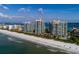 Amazing aerial showcases condos near beach and ocean, offering luxurious waterfront living at its finest at 1560 Gulf Blvd # 502, Clearwater Beach, FL 33767