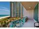 Condo balcony offers stunning views of the beach and adjacent high-rise at 1560 Gulf Blvd # 502, Clearwater Beach, FL 33767