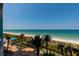 Enjoy panoramic beach views from this condo, featuring lush landscaping and a charming poolside area at 1560 Gulf Blvd # 502, Clearwater Beach, FL 33767