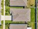 Overhead view showcasing the roof of the home, with a lawn and neighboring houses at 1615 Redmond Brook Ln, Ruskin, FL 33570