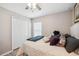 Bright bedroom featuring a bed with plenty of pillows and a closet at 1615 Redmond Brook Ln, Ruskin, FL 33570