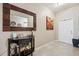 Inviting foyer with tile flooring, decorative mirror, console table, and stylish accents at 1615 Redmond Brook Ln, Ruskin, FL 33570