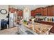 This kitchen boasts stainless steel appliances, granite counters, and a breakfast bar with seating at 1615 Redmond Brook Ln, Ruskin, FL 33570