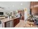 Spacious kitchen featuring stainless steel appliances, granite countertops, and an open layout at 1615 Redmond Brook Ln, Ruskin, FL 33570