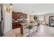 Open kitchen with granite counters, stainless appliances, island with seating and adjacent dining area at 1615 Redmond Brook Ln, Ruskin, FL 33570