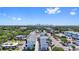 Aerial view of modern condos with views of the city skyline and lush green trees under a blue sky at 15 29Th N St # Lot 7, St Petersburg, FL 33713