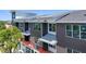 Close up of a modern multi-story condo building with white trim and red railings on the balconies at 15 29Th N St # Lot 7, St Petersburg, FL 33713