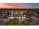Modern multi-story condo building with red railings and professional landscaping under a colorful sunset sky at 15 29Th N St # Lot 7, St Petersburg, FL 33713