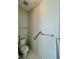 Bright half-bathroom equipped with grab bars for accessibility and tiled flooring at 1945 Fruitridge St, Brandon, FL 33510