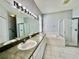 Large bathroom with double sinks, big mirrors, separate shower and tub at 1945 Fruitridge St, Brandon, FL 33510