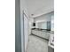 Bathroom with double sinks, long vanity, large mirrors, and tub at 1945 Fruitridge St, Brandon, FL 33510
