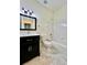 Bathroom features an updated vanity, a shower-tub combination, and modern tile flooring at 1945 Fruitridge St, Brandon, FL 33510